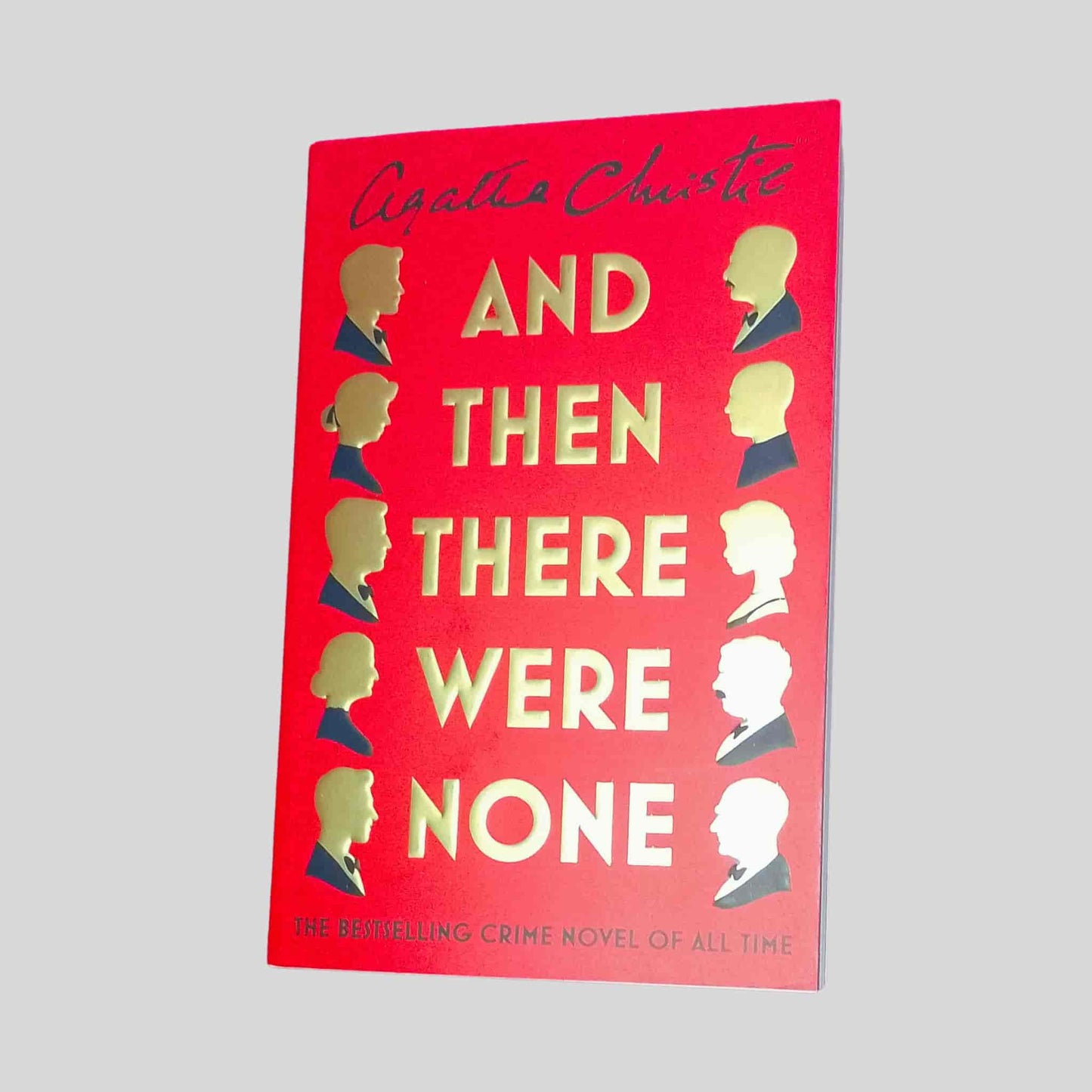 And Then There Were None by Agatha Christie – red and gold book cover of the bestselling crime and mystery novel