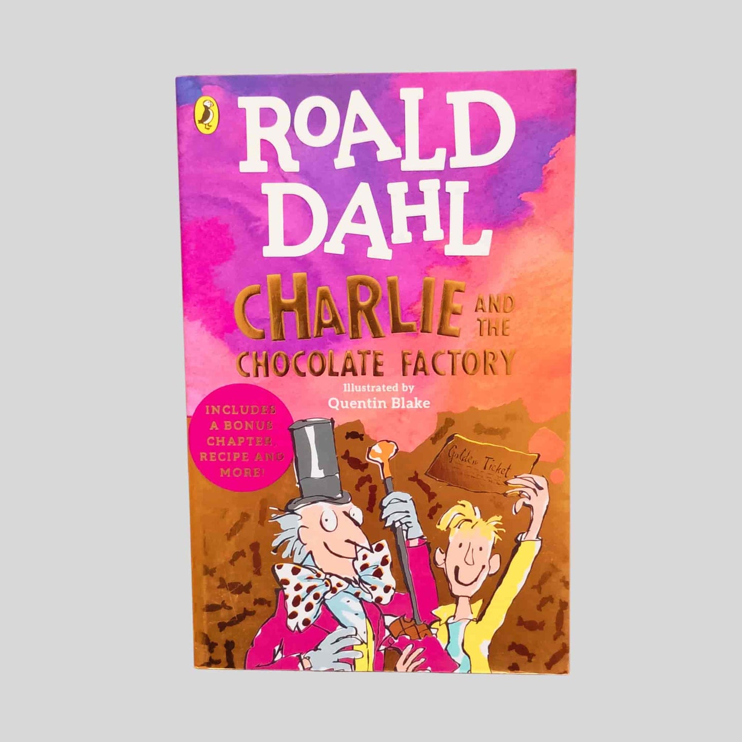Roald Dahl's Charlie and the Chocolate Factory – paperback kids book with cartoon illustrations of Willy Wonka and Charlie holding a golden ticket, illustrated by Quentin Blake