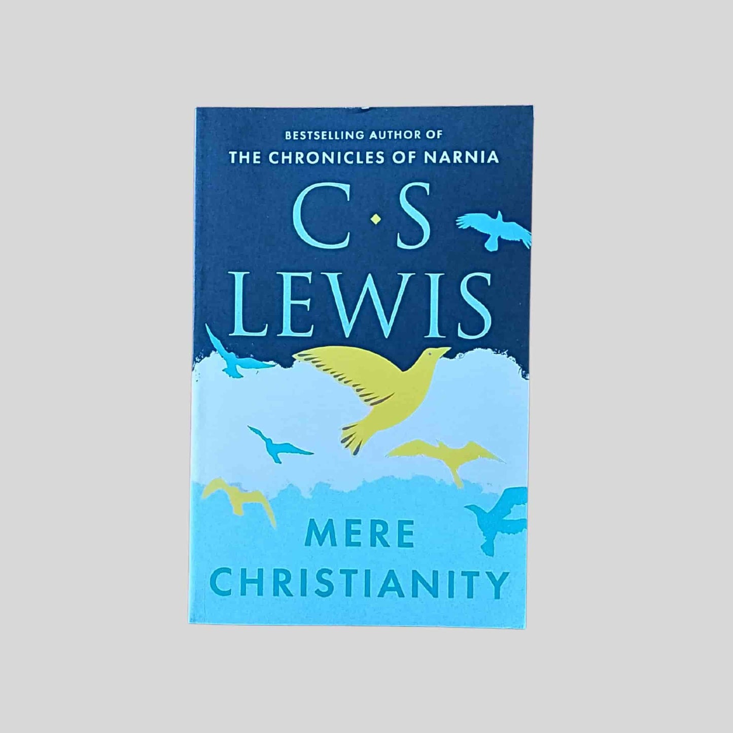 The paperback book called Mere Christianity by C. S. Lewis featuring birds in flight