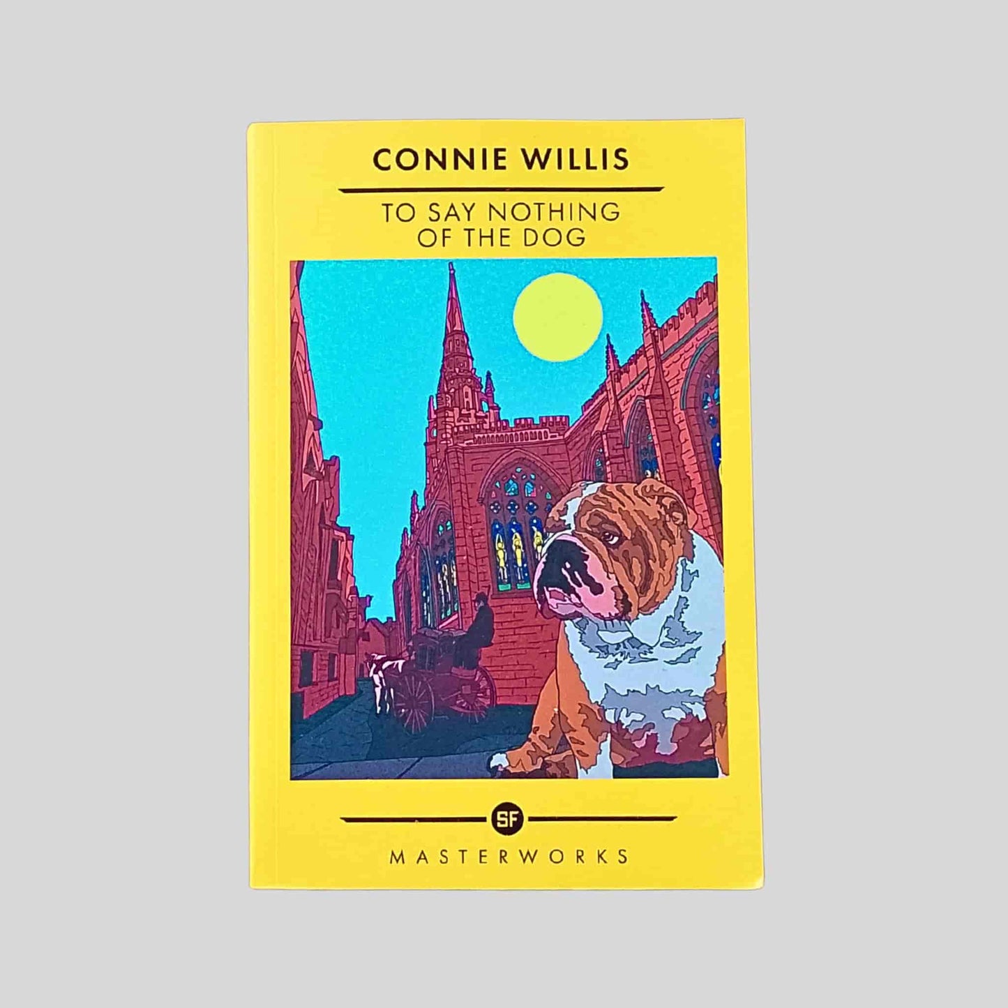 Paperback cover of To Say Nothing of the Dog by Connie Willis, showing a Victorian street scene with a bulldog in the foreground and a cathedral under a blue sky and yellow round sun