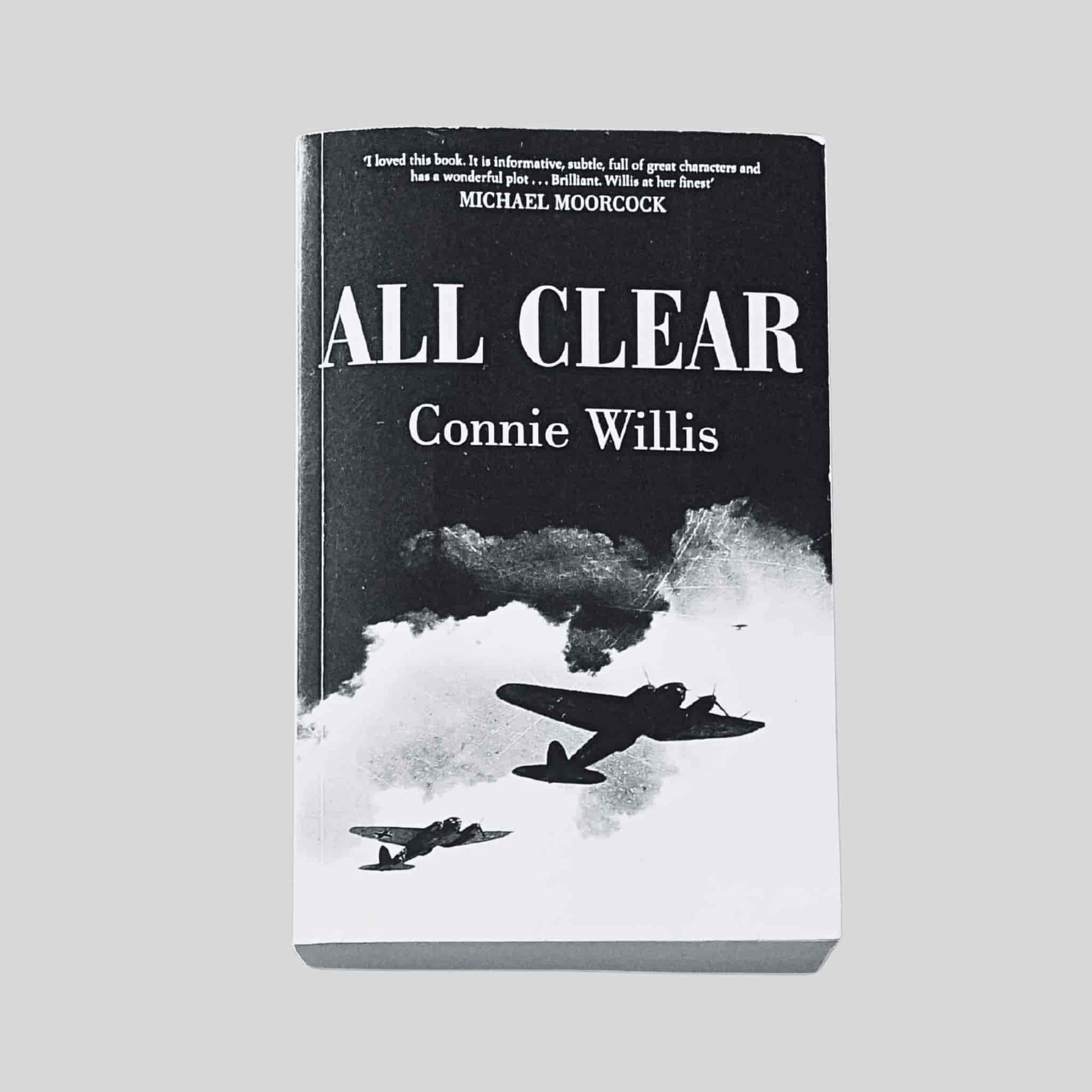 The front cover of All Clear by Connie Willis, paperback edition, showing black-and-white artwork of Second World War aircraft flying through clouds