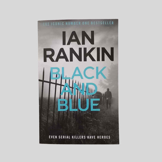 The crime thriller paperback book Black and Blue by Ian Rankin featuring Inspector Rebus hunting a serial killer across Scotland