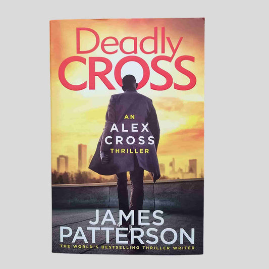 Deadly Cross by James Patterson – front cover of an Alex Cross thriller novel showing a silhouetted man against a city skyline at sunset