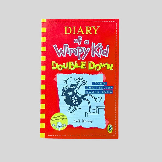 Front cover of the kids book called Diary of a Wimpy Kid Double Down showing Greg Heffley falling down steps on a red background