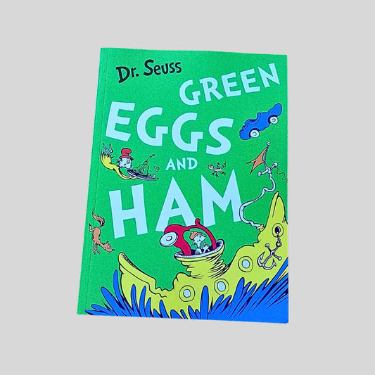 Book titled 'Green Eggs and Ham' by Dr. Seuss on a grey background