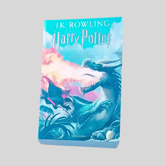 Harry Potter and the Goblet of Fire paperback book cover featuring Harry facing a dragon