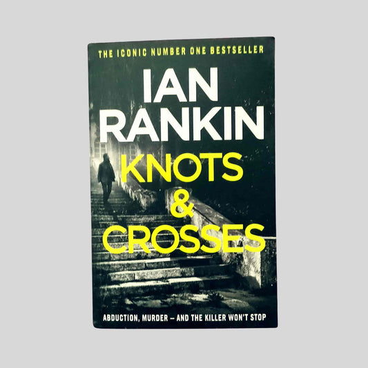 The crime thriller paperback book Knots and Crosses by Ian Rankin featuring Inspector Rebus investigating abductions and murders in Edinburgh