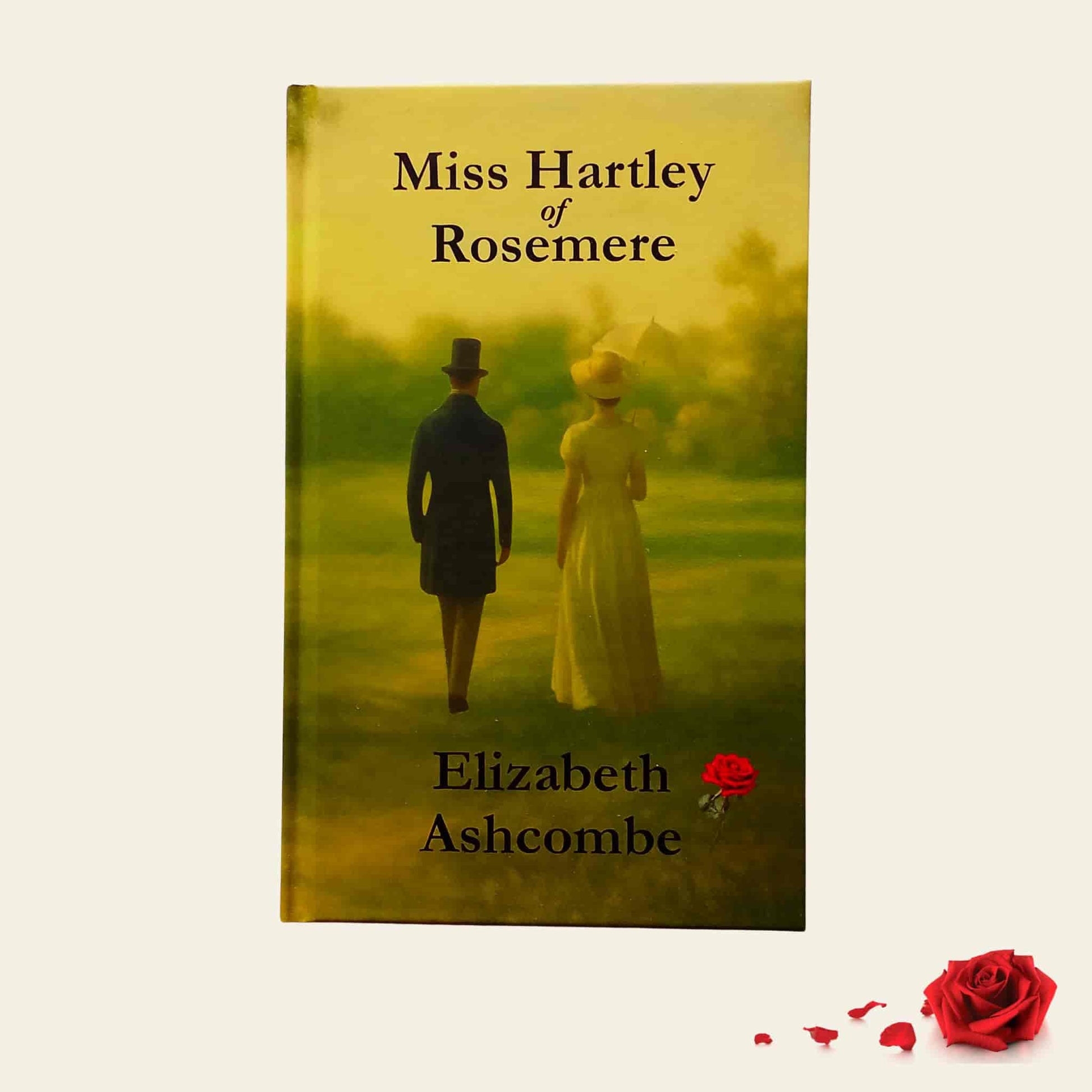 Jane Austen inspired hardcover book Miss Hartley of Rosemere by Elizabeth Ashcombe, showing a Regency-era couple walking through a golden landscape with a red rose detail