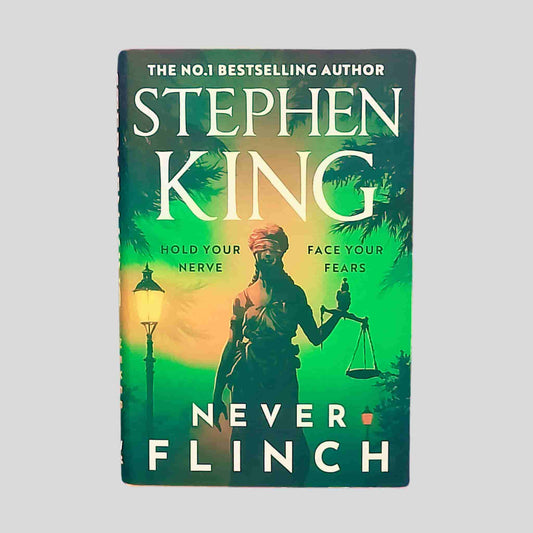 Front cover of Never Flinch by Stephen King – green and yellow background, statue holding scales of justice, and the tagline: Hold your nerve. Face your fears.