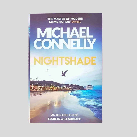 Front cover of Nightshade by Michael Connelly – sunset beach scene with bold orange title and tagline: As the tide turns, secrets will surface