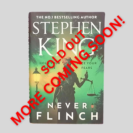Never Flinch by Stephen King – Thriller hardback book featuring the statue of justice under a green and gold sky
