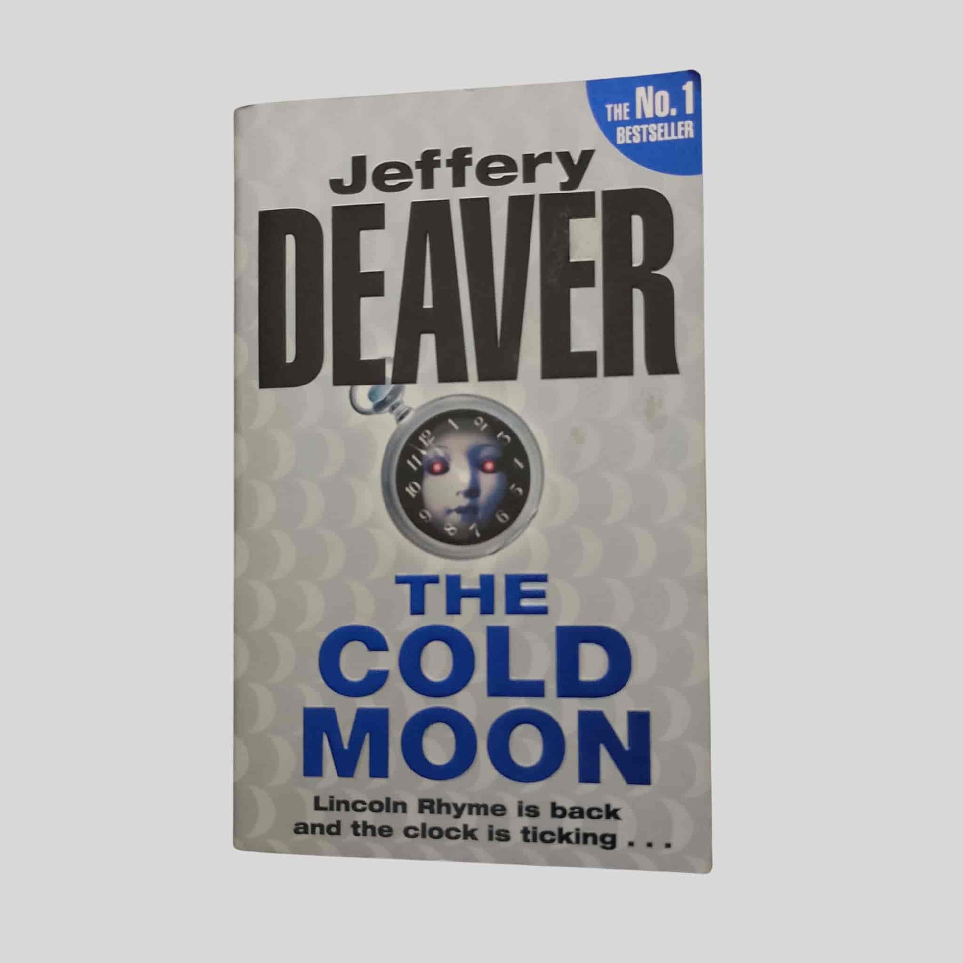 Book cover of The Cold Moon by Jeffery Deaver — thriller paperback book